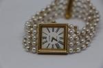 CHANEL - montre "Mademoiselle" en or jaune 18k, bracelet perles....
