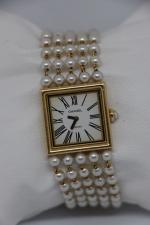 CHANEL - montre "Mademoiselle" en or jaune 18k, bracelet perles....