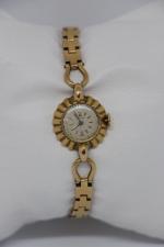 OMEGA: Montre bracelet de dame boitier et bracelet en or...