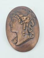 DOMMARTIN : Médaille en bronze représentant une femme de profil,...