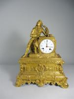 Pendule en bronze doré à décor d'un personnage élégant Charles...