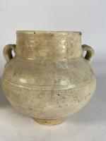 VIETNAM (?) : Deux vases en céramique à glaçure beige...