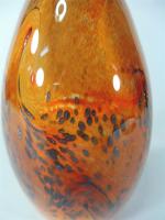 MILESI Gabriel : Vase ovoïde en verre orange à inclusions...