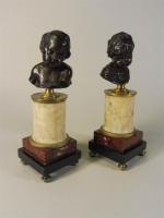 D'après FLAMAND : Bustes d'enfants, deux sujets en bronze montés...
