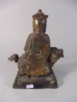 Guanyin assise sur un chien en  bronze à ...