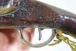 Pistolet modèle 1763-66 à silex transformé à percussion. 
Platine poinçonné...