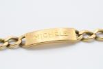 GOURMETTE gravée "Michelle" en or jaune 18k. L. 20 cm...