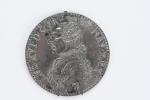 MEDAILLE ronde en bronze, face argenté, décor en bas-relief de...