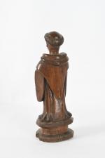 STATUETTE en bois sculpté à sujet de Saint Antoine (?)....