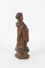 STATUETTE en bois sculpté à sujet de Saint Antoine (?)....