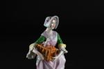 SITZENDORF XIXème, Femme tenant une cage en habit XVIIIème. Porcelaine...