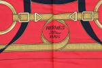 HERMES PARIS - Carré de soie "éperons d'or", fond rouge....