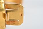 BRACELET rigide ouvrant en or jaune 750 millièmes serti d'une...