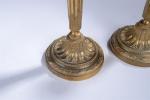 FLAMBEAUX (paire de) en bronze ciselé et doré à décor...