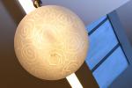 SUSPENSION sphère en verre dépoli à décor de motifs stylisés...
