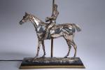 LAMPE "Jockey sur son cheval" en bronze argenté, montée sur...