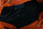 LONGCHAMP. Petit sac "seau" en cuir orange avec anse. Usures,...