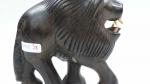 SUJET "Lion" en bois sculpté et décor d'incrustations d'ivoires aux...