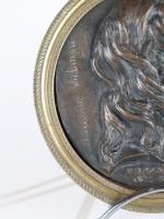 * DAVID D'ANGERS (1788-1856). Médaillon en bronze à patine brune...