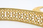 PARURE en or jaune 18k comprenant collier et bracelet souple...