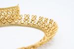 PARURE en or jaune 18k comprenant collier et bracelet souple...