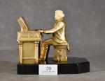 RUHL (J.) "l'organiste", sculpture en régule à patine dorée, socle...