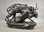 BARYE (L.) « Combat de cerf et lion » bronze à patine...