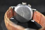 TELDA : montre bracelet chronographe en acier. Cadran en métal argenté....