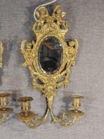 Paire d'appliques miroir en bronze doré à décor de puttis...