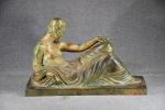 BEGUIN (Gaston) "Femme allongée",  bronze à patine brun-vert de...