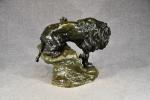 CARTIER (T) "Lion rugissant" bronze à patine verte, H =...