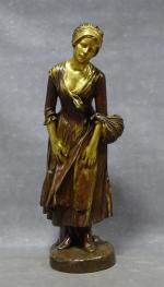 MERCIE (C.) "Jeune fille", bronze à patine brune et or,...