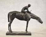 FERRARI "Jockey",  bronze à patine brune , long =...