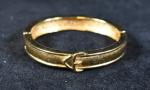 CHRISTIAN DIOR : Bracelet "Boucle de ceinture" en métal doré...
