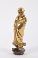 CHINE - XXe siècle
Statuette de Dhamo debout en bronze dépatiné,...