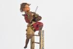 "Le bouffon", violoniste au sommet d'une échelle
qui se balance en...