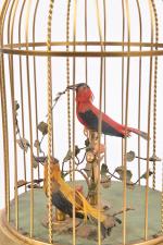 Cage à deux oiseaux chanteurs
en tôle dorée. Allemagne milieu XIXème....