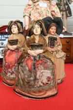 Trois femmes type alsacienne
tête et mains en composition peinte, montées...