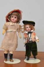 Deux petites poupées tête porcelaine allemande
bouche ouverte, yeux dormeurs, corps...