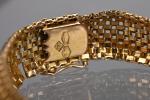 Bracelet en or jaune 18K 750‰
composé de motifs en briques...