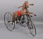 Petit cheval tricycle fin XIXème
repeint marron, trois roues en fer,...