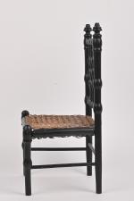 Chaise cannée en bois noirci. 
H. assise : 16 cm.