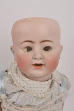 Bébé allemand tête porcelaine marquée en creux
"ABG 1361.55" bouche ouverte...