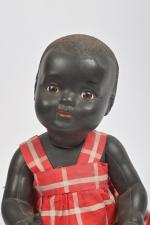 Convert, bébé noir en celluloïd
chevelure floquée, yeux de verre marron,...