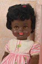 Raynal, Claudine
poupée noire en plastique souple, bouche ouverte-fermée, yeux marron...