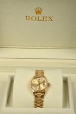 Rolex Oyster Perpetual Date.
Montre de poignet de dame en or...