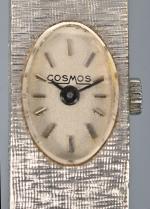 Cosmos
Montre bracelet de dame en or gris à mailles rigides...