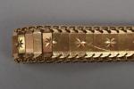 Bracelet en or deux tons 18K 750 millièmes
articulé, décoré de...
