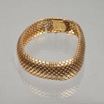 Bracelet en or jaune 18K 750 millièmes
composé de motifs en...