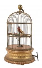 Bontems, cage ronde à un oiseau chanteur,
socle en bois doré,...